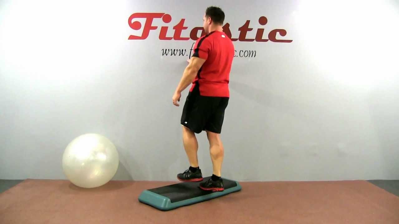 Man demonstrating a single-leg body weight calf raise on a step platform to strengthen calf muscles